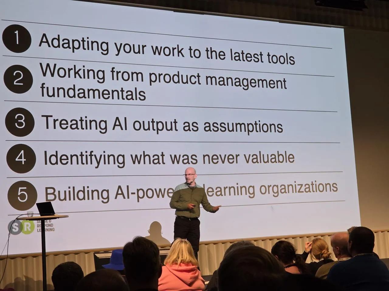Jeff Gothelf on stage at ScanAgile 2026 discussing how AI made it easy and how to determine what good work looks like in the age of AI